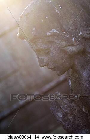 "Praying stone angel, backlit, West Norwood Cemetery, London, London region, England, United Kingdom, Europe" View Large Photo Image Picture - "Praying stone angel, backlit, West Norwood Cemetery, London, London region, England, United Kingdom, Europe". Fotosearch