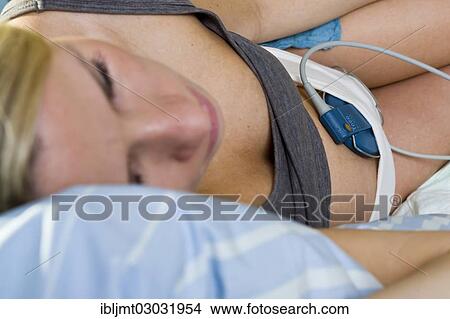 "Pregnant woman resting on a delivery bed during childbirth connected to a cardiotocography or CTG, Germany, Europe" View Large Photo Image Picture - "Pregnant woman resting on a delivery bed during childbirth connected to a cardiotocography or CTG, Germany, Europe". Fotosearch