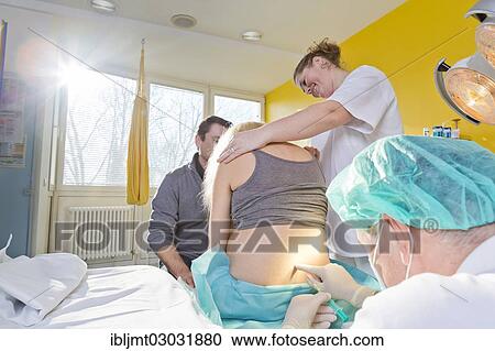 "Pregnant women during delivery in the delivery room with an anesthesiologist applying a PDA or epidural, Germany, Europe" View Large Photo Image Stock Image - "Pregnant women during delivery in the delivery room with an anesthesiologist applying a PDA or epidural, Germany, Europe". Fotosearch