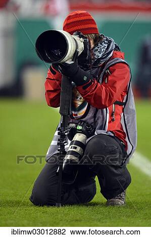 Stock Image - "Press photographer, sports photographer, Mercedes-Benz Arena, Stuttgart, Baden-Wurttemberg, Germany, Europe". Fotosearch