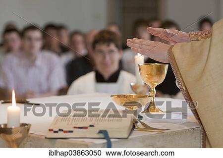 "Priest blessing the holy sacrament, seminary, Wolfratshausen, Upper Bavaria, Bavaria, Germany, Europe" View Large Photo Image Stock Image - "Priest blessing the holy sacrament, seminary, Wolfratshausen, Upper Bavaria, Bavaria, Germany, Europe". Fotosearch