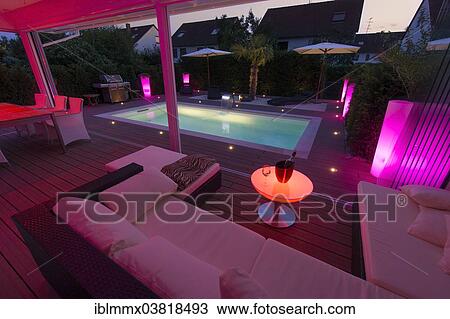 "Private house at night with display lighting, a conservatory, a lounge, a pool and a terrace, Germany, Europe" View Large Photo Image Stock Image - "Private house at night with display lighting, a conservatory, a lounge, a pool and a terrace, Germany, Europe". Fotosearch