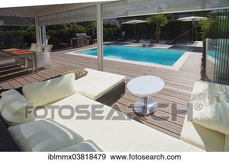 "Private house with a conservatory, a lounge, a pool and a terrace, Germany, Europe" View Large Photo Image Stock Photo - "Private house with a conservatory, a lounge, a pool and a terrace, Germany, Europe". Fotosearch