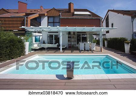 "Private terraced house with a conservatory, a pool and a terrace, Germany, Europe" View Large Photo Image Stock Image - "Private terraced house with a conservatory, a pool and a terrace, Germany, Europe". Fotosearch