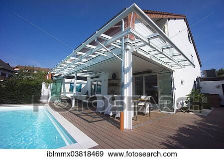 "Private terraced house with a conservatory, a pool and a terrace, Germany, Europe" View Large Photo Image Stock Photo - "Private terraced house with a conservatory, a pool and a terrace, Germany, Europe". Fotosearch