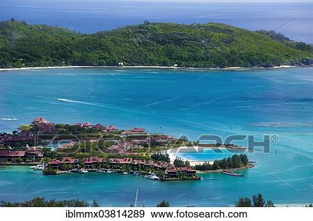 "Private villas, marina of Eden Island, in front of the island of Ile au Cerf, Seychelles, Africa" View Large Photo Image Stock Photo - "Private villas, marina of Eden Island, in front of the island of Ile au Cerf, Seychelles, Africa". Fotosearch