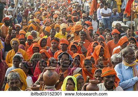 Stock Image - "Procession of devotees dressed in orange, during Kumbha Mela, Allahabad, Uttar Pradesh, India, Asia". Fotosearch