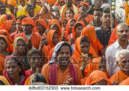 Stock Image - "Procession of devotees dressed in orange, during Kumbha Mela, Allahabad, Uttar Pradesh, India, Asia". Fotosearch