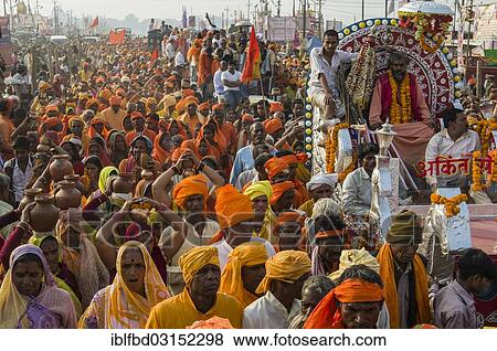Stock Photo - "Procession of devotees dressed in orange, during Kumbha Mela, Allahabad, Uttar Pradesh, India, Asia". Fotosearch