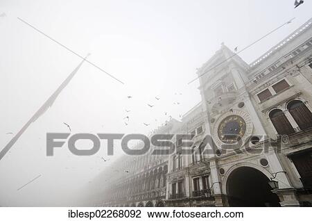 "Procuratie building and Torre dell'orologio clock tower in the fog, St. Mark's Square, Piazza San Marco, Venice, Venezia, Veneto, Italy, Europe" View Large Photo Image Stock Image - "Procuratie building and Torre dell'orologio clock tower in the fog, St. Mark's Square, Piazza San Marco, Venice, Venezia, Veneto, Italy, Europe". Fotosearch