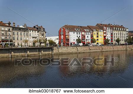 Stock Photo - "Promenade on the Moselle River, modern residential and commercial buildings, city centre, Epinal, Lorraine, Departement Vosges, France, Europe". Fotosearch