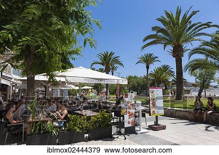 "Promenade with outdoor restaurants, Cala Sant Vicenc, Pollenca, Port de Pollenca, Mallorca, Majorca, Balearic Islands, Spain, Europe" View Large Photo Image Stock Photo - "Promenade with outdoor restaurants, Cala Sant Vicenc, Pollenca, Port de Pollenca, Mallorca, Majorca, Balearic Islands, Spain, Europe". Fotosearch