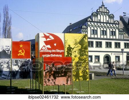 "Propaganda boards for the 40th Anniversary of the victory over Nazism and the liberation, with the flag of the USSR, a Renaissance house on the right, Weimar in April 1985, GDR, German Democratic Republic, Europe" View Large Photo Image Stock Image - "Propaganda boards for the 40th Anniversary of the victory over Nazism and the liberation, with the flag of the USSR, a Renaissance house on the right, Weimar in April 1985, GDR, German Democratic Republic, Europe". Fotosearch