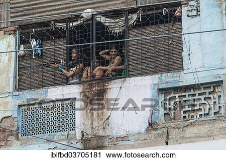 "Prostitutes looking out of a window secured with bars waving to potential customers in the redlight district, New Delhi, Delhi, India, Asia" View Large Photo Image Stock Image - "Prostitutes looking out of a window secured with bars waving to potential customers in the redlight district, New Delhi, Delhi, India, Asia". Fotosearch