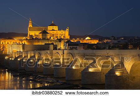 "Puente Romano, spanning the Guadalquivir river, and the Mezquita at the back, illuminated at dusk, Cordoba, Cordoba province, Andalusia, Spain, Europe" View Large Photo Image Stock Image - "Puente Romano, spanning the Guadalquivir river, and the Mezquita at the back, illuminated at dusk, Cordoba, Cordoba province, Andalusia, Spain, Europe". Fotosearch