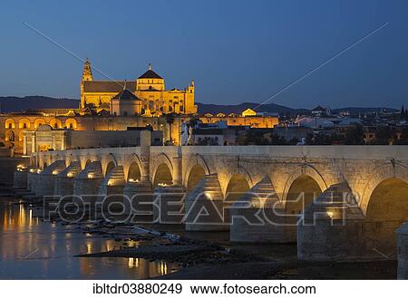 "Puente Romano, spanning the Guadalquivir river, and the Mezquita at the back, illuminated at dusk, Cordoba, Cordoba province, Andalusia, Spain, Europe" View Large Photo Image Stock Photo - "Puente Romano, spanning the Guadalquivir river, and the Mezquita at the back, illuminated at dusk, Cordoba, Cordoba province, Andalusia, Spain, Europe". Fotosearch