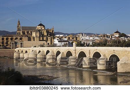 Stock Photography - "Puente Romano, spanning the Guadalquivir river, and the Mezquita at the back, Cordoba, Cordoba province, Andalusia, Spain, Europe". Fotosearch