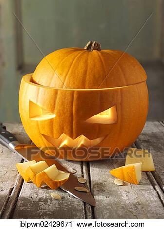 Pumpkin with a traditional carved Halloween face View Large Photo Image Stock Image - Pumpkin with a traditional carved Halloween face. Fotosearch