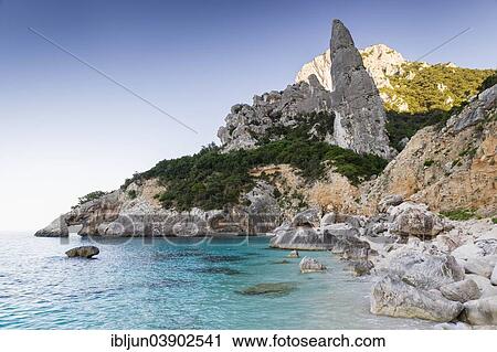 "Punta Caroddi pinnacle in Cala Goloritze bay, in the evening light, Golfo di Orosei, Golfo di Orosei und Gennargentu National Park, Sardinia, Italy, Europe" View Large Photo Image Stock Image - "Punta Caroddi pinnacle in Cala Goloritze bay, in the evening light, Golfo di Orosei, Golfo di Orosei und Gennargentu National Park, Sardinia, Italy, Europe". Fotosearch