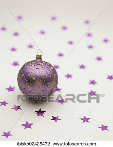 Purple Christmas bauble lying on purple stars View Large Photo Image Stock Image - Purple Christmas bauble lying on purple stars. Fotosearch