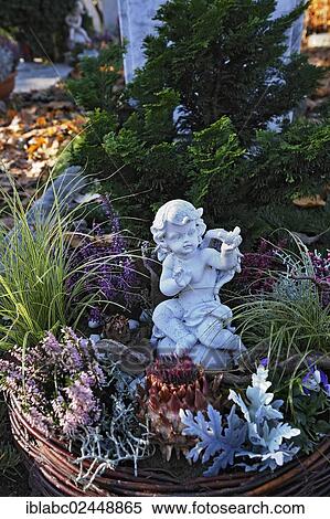 "Putto on grave, Ostfriedhof, East Cemetery, Munich, Bavaria, Germany, Europe" View Large Photo Image Stock Photography - "Putto on grave, Ostfriedhof, East Cemetery, Munich, Bavaria, Germany, Europe". Fotosearch