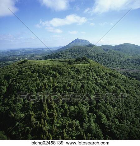 "Puy des Goules in front of Puy de Dome, Parc Naturel Regional des Volcans d'Auvergne, Natural regional park of Volcans d'Auvergne, Puy de Dome, Auvergne, France, Europe" View Large Photo Image Stock Photo - "Puy des Goules in front of Puy de Dome, Parc Naturel Regional des Volcans d'Auvergne, Natural regional park of Volcans d'Auvergne, Puy de Dome, Auvergne, France, Europe". Fotosearch