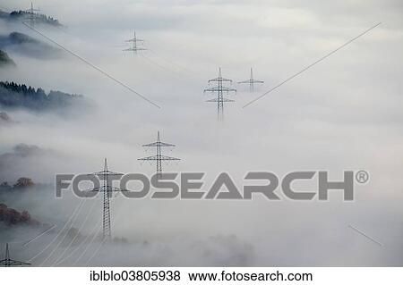 "Pylons in the fog, at Bestwig, Sauerland, North Rhine-Westphalia, Germany, Europe" View Large Photo Image Stock Photo - "Pylons in the fog, at Bestwig, Sauerland, North Rhine-Westphalia, Germany, Europe". Fotosearch