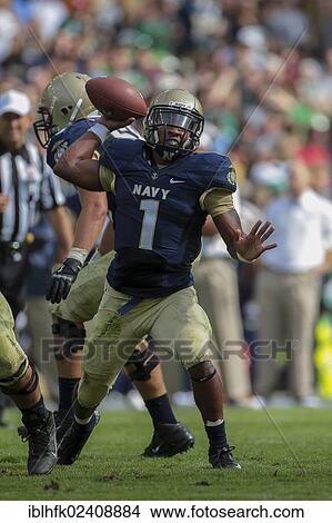 "QB Trey Miller, #1 Navy, passes the ball during the NCAA football game between the Navy and the Notre Dame on September 1, 2012 in Dublin, Ireland, Europe" View Large Photo Image Picture - "QB Trey Miller, #1 Navy, passes the ball during the NCAA football game between the Navy and the Notre Dame on September 1, 2012 in Dublin, Ireland, Europe". Fotosearch