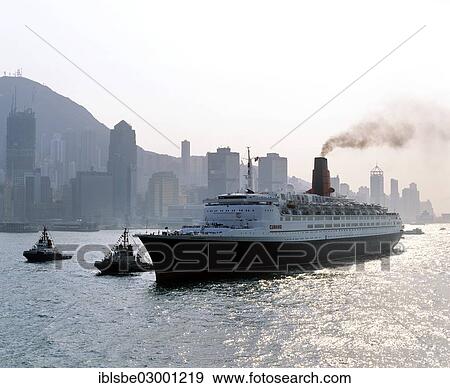 Stock Photo - "Queen Elizabeth 2 in front of the skyline of Victoria Island, Central District, Hong Kong, Hong Kong Island, Hong kong, China, People's Republic of China, Asia". Fotosearch