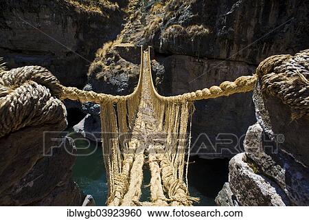 Stock Image - "Qu'eswachaka suspension bridge, rope bridge made of woven Peruvian Feathergrass (Stipa ichu), over the Apurimac River, last known working Inca suspension bridge, national cultural heritage of Peru, Southern Peru, Peru, South America". Fotosearch