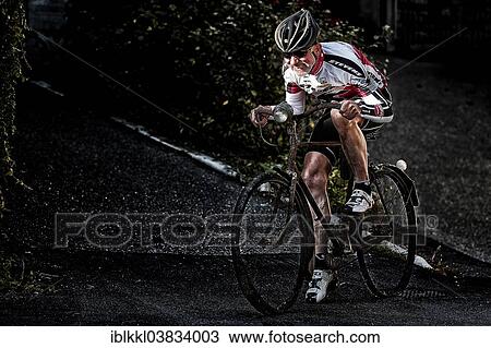"Racing cyclist riding on an old bicycle, Alto Adige, Italy, Europe" View Large Photo Image Stock Image - "Racing cyclist riding on an old bicycle, Alto Adige, Italy, Europe". Fotosearch