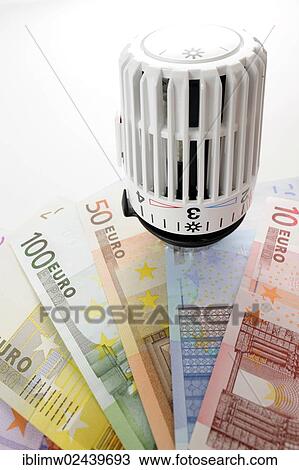 "Radiator valve with euro banknotes, symbolic image for heating costs, energy costs" View Large Photo Image Stock Image - "Radiator valve with euro banknotes, symbolic image for heating costs, energy costs". Fotosearch