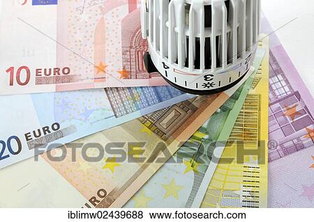 "Radiator valve with euro banknotes fanned out, symbolic image for heating costs, energy costs" View Large Photo Image Stock Photo - "Radiator valve with euro banknotes fanned out, symbolic image for heating costs, energy costs". Fotosearch