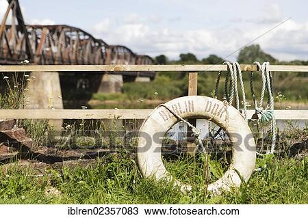 "Railway bridge over the border river Oder, Polish-German border, Kuestrin to Kostrzyn, life buoy with the inscription """"Berlin DDR"""", Brandenburg, Germany, Europe" View Large Photo Image Stock Image - "Railway bridge over the border river Oder, Polish-German border, Kuestrin to Kostrzyn, life buoy with the inscription """"Berlin DDR"""", Brandenburg, Germany, Europe". Fotosearch