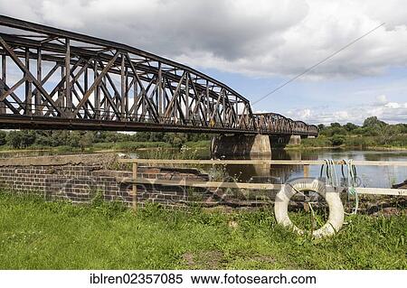 "Railway bridge over the border river Oder, Polish-German border, Kuestrin to Kostrzyn, life buoy with the inscription """"Berlin DDR"""", Brandenburg, Germany, Europe" View Large Photo Image Stock Photography - "Railway bridge over the border river Oder, Polish-German border, Kuestrin to Kostrzyn, life buoy with the inscription """"Berlin DDR"""", Brandenburg, Germany, Europe". Fotosearch