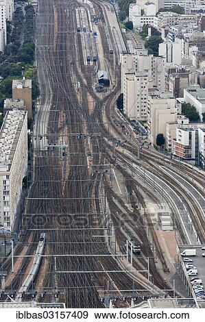 "Railway tracks leading to Gare Montparnasse railway station, seen from Tour Montparnasse tower, Montparnasse, Paris, Ile-de-France, France, Europe" View Large Photo Image Stock Photo - "Railway tracks leading to Gare Montparnasse railway station, seen from Tour Montparnasse tower, Montparnasse, Paris, Ile-de-France, France, Europe". Fotosearch