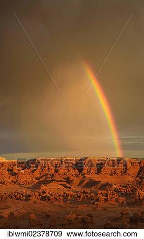 Stock Photo - "Rainbow during a thunderstorm, eroded hoodoos and Entrada Sandstone rock formations, Goblins, Goblin Valley State Park, San Rafael Reef Desert, Utah, Southwestern USA, USA". Fotosearch