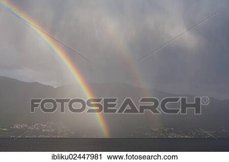 "Rainbow over lake Lago Maggiore, view from Casa Moscia, Ascona, Ticino, Switzerland, Europe" View Large Photo Image Stock Image - "Rainbow over lake Lago Maggiore, view from Casa Moscia, Ascona, Ticino, Switzerland, Europe". Fotosearch