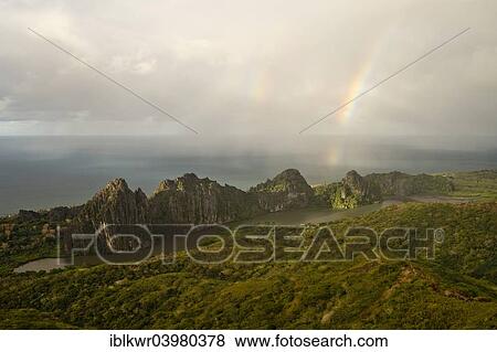 Stock Photo - "Rainbow over the Linderalique Rocks off the coast, Hienghene, North Province, Grande Terre, New Caledonia, Oceania". Fotosearch