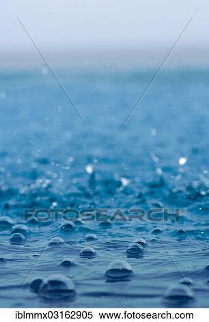 Stock Photography - "Raindrops falling into the sea, Indonesia, Asia". Fotosearch
