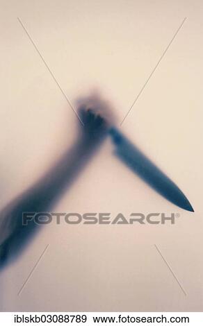 Raised hand holding a large butcher's knife behind frosted glass View Large Photo Image Stock Photo - Raised hand holding a large butcher's knife behind frosted glass. Fotosearch