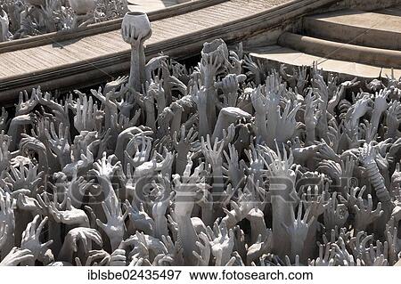 Stock Photo - "Raised hands seeking help, sculpture, Wat Rong Khun, Chiang Rai, Northern Thailand, Thailand, Asia". Fotosearch
