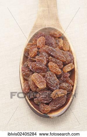 "Raisins, sultanas, on a wooden spoon" View Large Photo Image Picture - "Raisins, sultanas, on a wooden spoon". Fotosearch