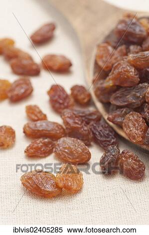 Stock Photography - "Raisins, sultanas, on a wooden spoon". Fotosearch