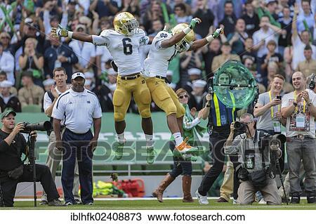 Stock Image - "RB George Atkinson, #4 Notre Dame, and RB Theo Riddick, #6 Notre Dame, celebrate a touchdown during the NCAA football game between the Navy and the Notre Dame on September 1, 2012 in Dublin, Ireland, Europe". Fotosearch