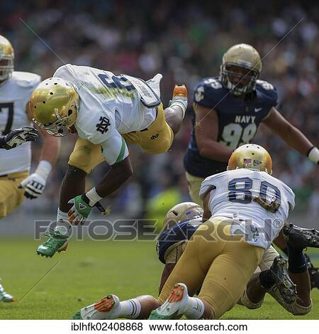 Stock Photo - "RB Theo Riddick, #6 Notre Dame, runs with the ball during the NCAA football game between the Navy and the Notre Dame on September 1, 2012 in Dublin, Ireland, Europe". Fotosearch
