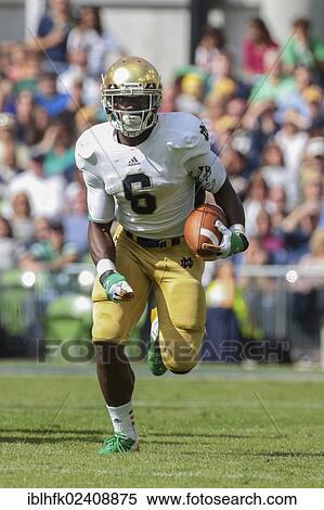 "RB Theo Riddick, #6 Notre Dame, runs with the ball during the NCAA football game between the Navy and the Notre Dame on September 1, 2012 in Dublin, Ireland, Europe" View Large Photo Image Stock Photography - "RB Theo Riddick, #6 Notre Dame, runs with the ball during the NCAA football game between the Navy and the Notre Dame on September 1, 2012 in Dublin, Ireland, Europe". Fotosearch