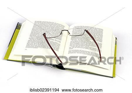 Reading glasses lying on a book View Large Photo Image Picture - Reading glasses lying on a book. Fotosearch
