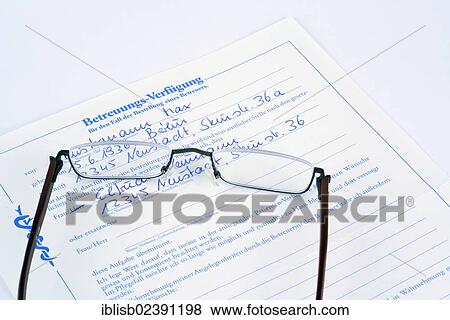 Reading glasses lying on a German health care proxy View Large Photo Image Stock Photo - Reading glasses lying on a German health care proxy. Fotosearch