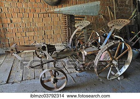 Picture - "Reaping machine from 1900, in a barn, Middle Franconia, Bavaria, Germany, Europe". Fotosearch